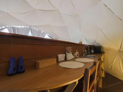 a wooden counter with two sinks in a tent at Moonlight glamping in Fortuna