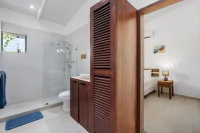 a bathroom with a shower and a toilet and a sink at 3-BD Home with Pool Near Beach in Brasilito