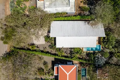an overhead view of a yard with a house and a pool at 3-BD Home with Pool Near Beach in Brasilito