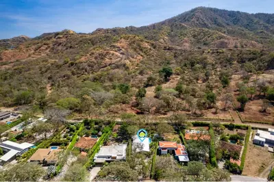 an aerial view of a house with a mountain in the background at 3-BD Home with Pool Near Beach in Brasilito