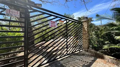 a gate with a no trespassing sign on it at Nidos Paradise's in Buenos Aires