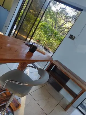 a desk with a chair in front of a window at Nidos Paradise's in Buenos Aires