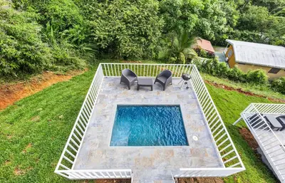 an overhead view of a swimming pool in a yard at Casa amor del sol apartment # 3 in Tarcoles