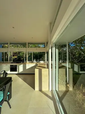 an open kitchen and living room of a house at Ocean View Villa 2min to beach - Casa Cantini in Montezuma