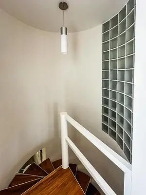 a stairway with a glass window on the wall at Ocean View Villa 2min to beach - Casa Cantini in Montezuma
