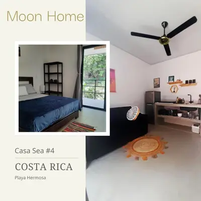 a bedroom with a bed and a ceiling fan at Moon Home Sea #4 in Playa hermosa