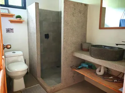 a bathroom with a sink and a toilet at Moon Home Sea #4 in Playa hermosa