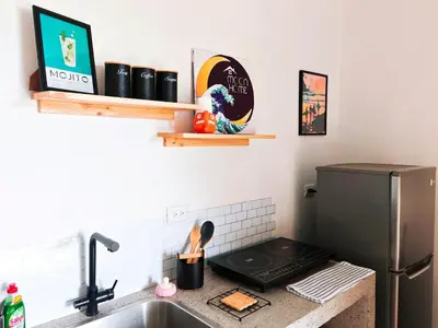 a kitchen with a sink and a refrigerator at Moon Home Sea #4 in Playa hermosa