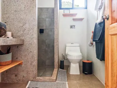 a bathroom with a toilet and a shower at Moon Home Sea #4 in Playa hermosa
