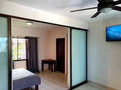 a room with a bed and a ceiling fan at Apartment hotel Marina Loft 207 in Coco