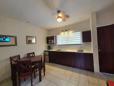 a kitchen with a table and a dining room at Marina Loft Condos 223 in Coco