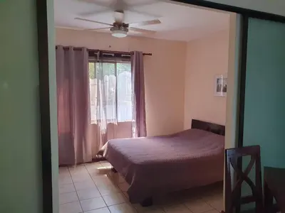 a bedroom with a bed and a window at Marina Loft Condos 218 in Coco