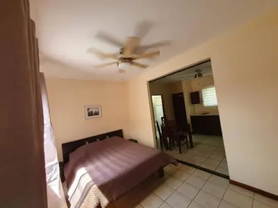 a bedroom with a bed and a ceiling fan at Marina Loft Condos 218 in Coco