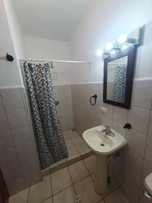 a bathroom with a sink and a shower at Marina Loft Condos 218 in Coco