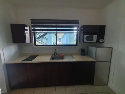 a small kitchen with a sink and a window at Marina Loft Condos 218 in Coco