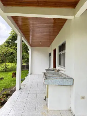 an outdoor kitchen with a wooden roof on a patio at Alojamiento tranquilo rodeado de paz y serenidad in Río Negro
