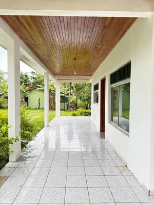 an empty porch of a house with a wooden ceiling at Alojamiento tranquilo rodeado de paz y serenidad in Río Negro