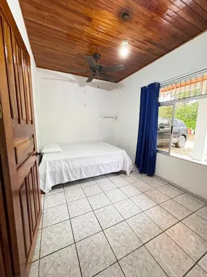 a bedroom with a bed and a window at Alojamiento tranquilo rodeado de paz y serenidad in Río Negro