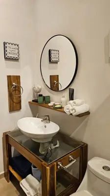 a bathroom with a sink and a mirror at Zoa Villas - Santa Teresa - 2 min walk to beach in Santa Teresa Beach