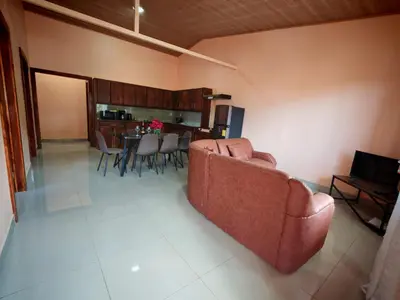 a living room with a couch and a dining room at Monteverde Twins in Monteverde Costa Rica