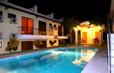 a villa with a swimming pool at night at Vista perfecta dos ap 8 in Artola
