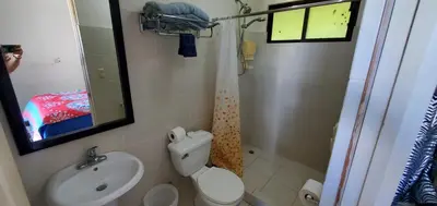 a bathroom with a toilet and a sink and a shower at Vista perfecta dos ap 8 in Artola