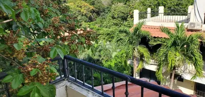 a balcony of a house with trees and plants at Vista perfecta dos ap 8 in Artola