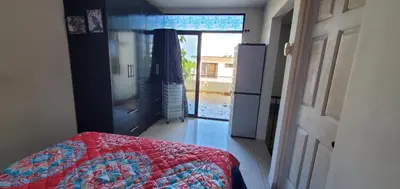 a bedroom with a bed and a door to a patio at Vista perfecta dos ap 8 in Artola