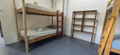 a room with two bunk beds in a room at Abacaxi Box Studios in Santa Teresa Beach