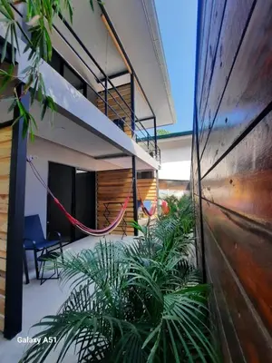 a view of a house with a patio with plants at Moon Home Sun #3 in Playa hermosa