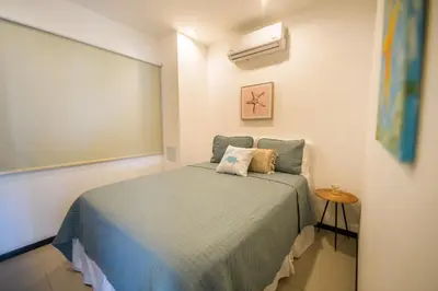 a bedroom with a bed in a room at Beautiful beachfront condo, amazing pool in Bejuco
