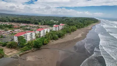 an aerial view of the beach and ocean at Beautiful beachfront condo, amazing pool in Bejuco