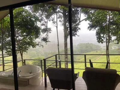 a bath tub sitting on a balcony with a view at Casita El Perezoso in San Rafael