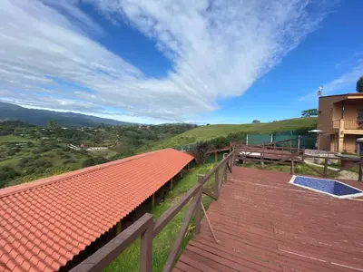an orange tile roof on a building with a view at Hotel Orocay Lodge in Cartago