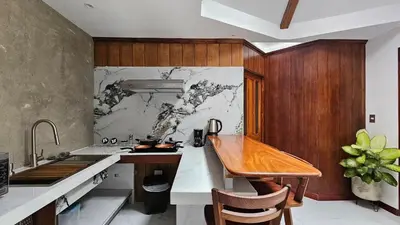 a kitchen with a sink and a counter top at The Hideaway La Fortuna in Fortuna