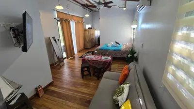 a living room with a couch and a table at Bahia Ballena Walk to the Beach Uvita Apartments in Uvita
