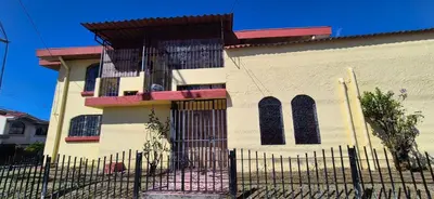a building with a fence in front of it at Hostal Zurgab in San Vicente