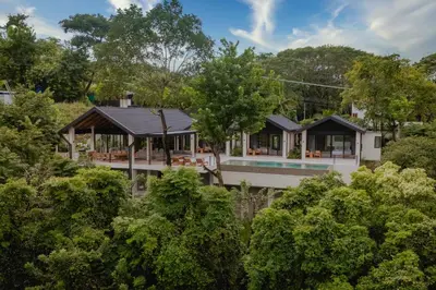 an aerial view of a house with a pool at Bahia Rooms in Mal País
