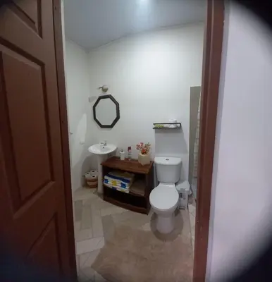 a bathroom with a toilet and a sink at Villa Fortuna in San José Pinilla