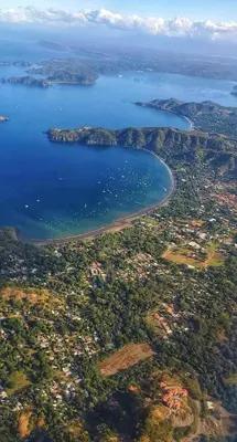 an aerial view of a city and a body of water at Casa Rosa del Mar in Coco