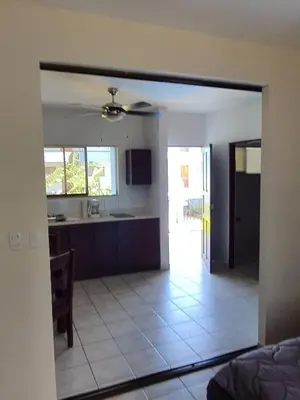 a view of a kitchen and a living room at Marina Loft Condos 212 in Coco