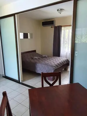 a bedroom with a bed and a large mirror at Marina Loft Condos 212 in Coco