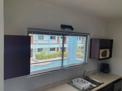 a kitchen with a sink and a window with a view at Marina Loft Studio 224 in Coco