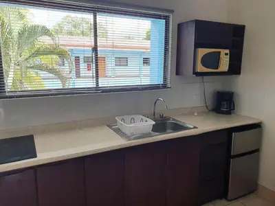 a kitchen counter with a sink and a window at Marina Loft Studio 224 in Coco