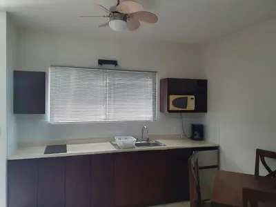 a kitchen with a sink and a ceiling fan at Marina Loft Studio 224 in Coco