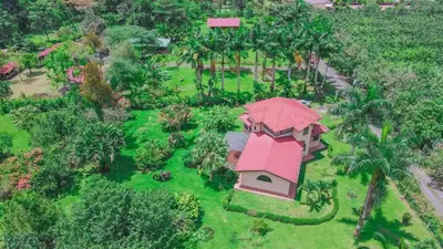 an overhead view of a house with a pink roof at Arenal Tropical Home Villa in Fortuna