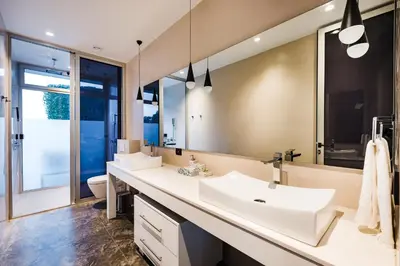 a bathroom with a white sink and a mirror at Costa Rica Luxury Ocean View in Playa Ostional