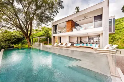 an exterior view of a house with a swimming pool at Costa Rica Luxury Ocean View in Playa Ostional