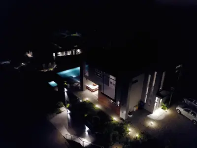 a night view of a building with lights at Costa Rica Luxury Ocean View in Playa Ostional