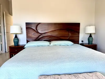 a bedroom with a large bed with two lamps at Villas with breathtaking seaview in Marbella